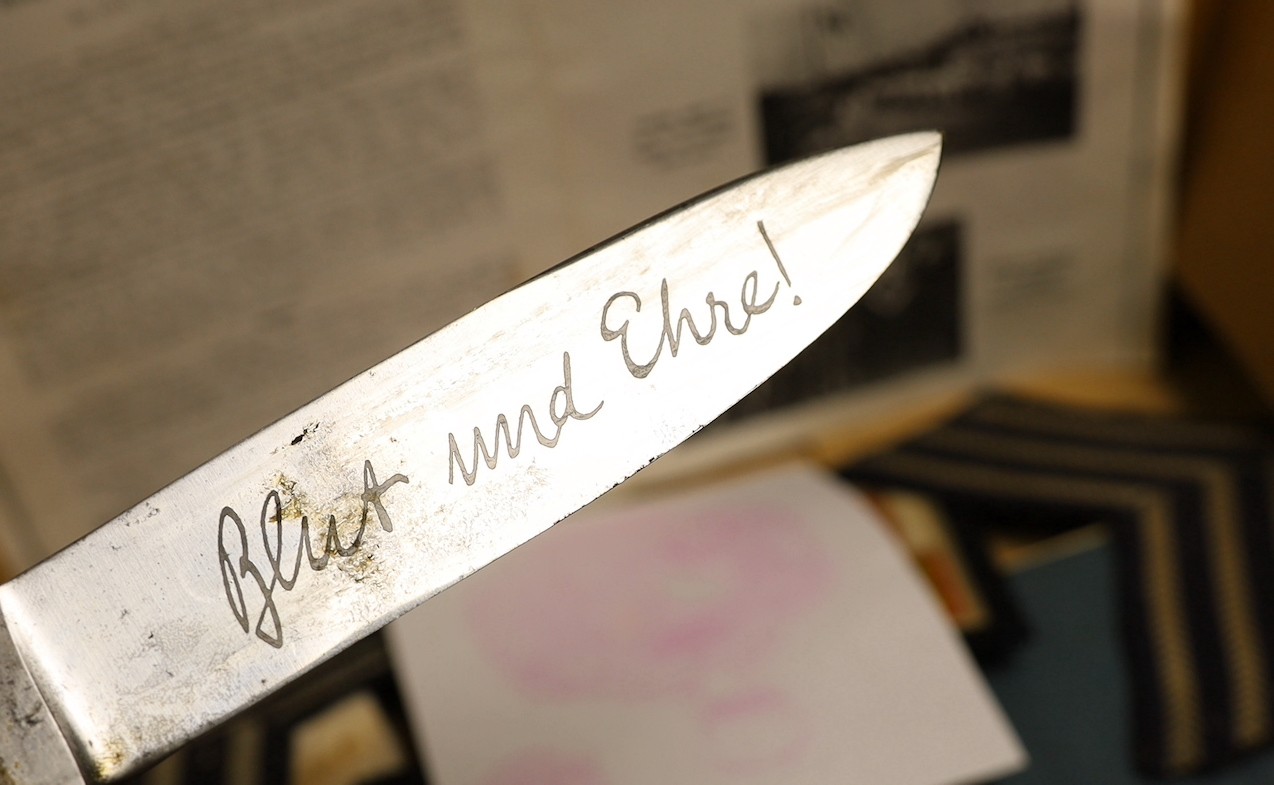 A Hitler youth knife, Observer's and Air Gunner's log-book, 1940, swimming material, all relating to George Eley, RAF